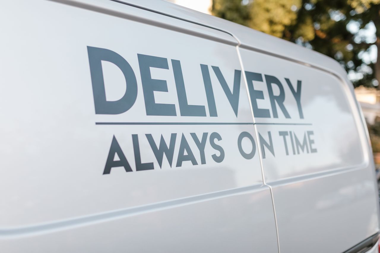 Crafting Captivating Headlines: Your awesome post title goes here Close-up of delivery van with slogan 'Always On Time' emphasizing timely service.